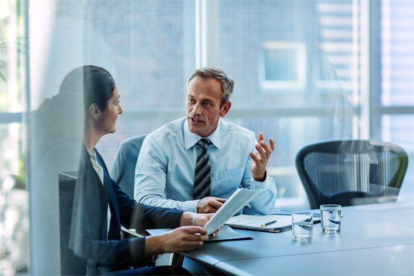 Image of two lawyers conversing