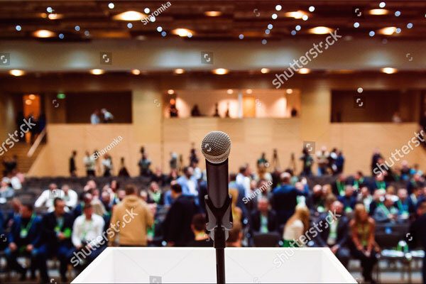 Image of a microphone in a conference room